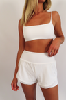 heat active stride short white